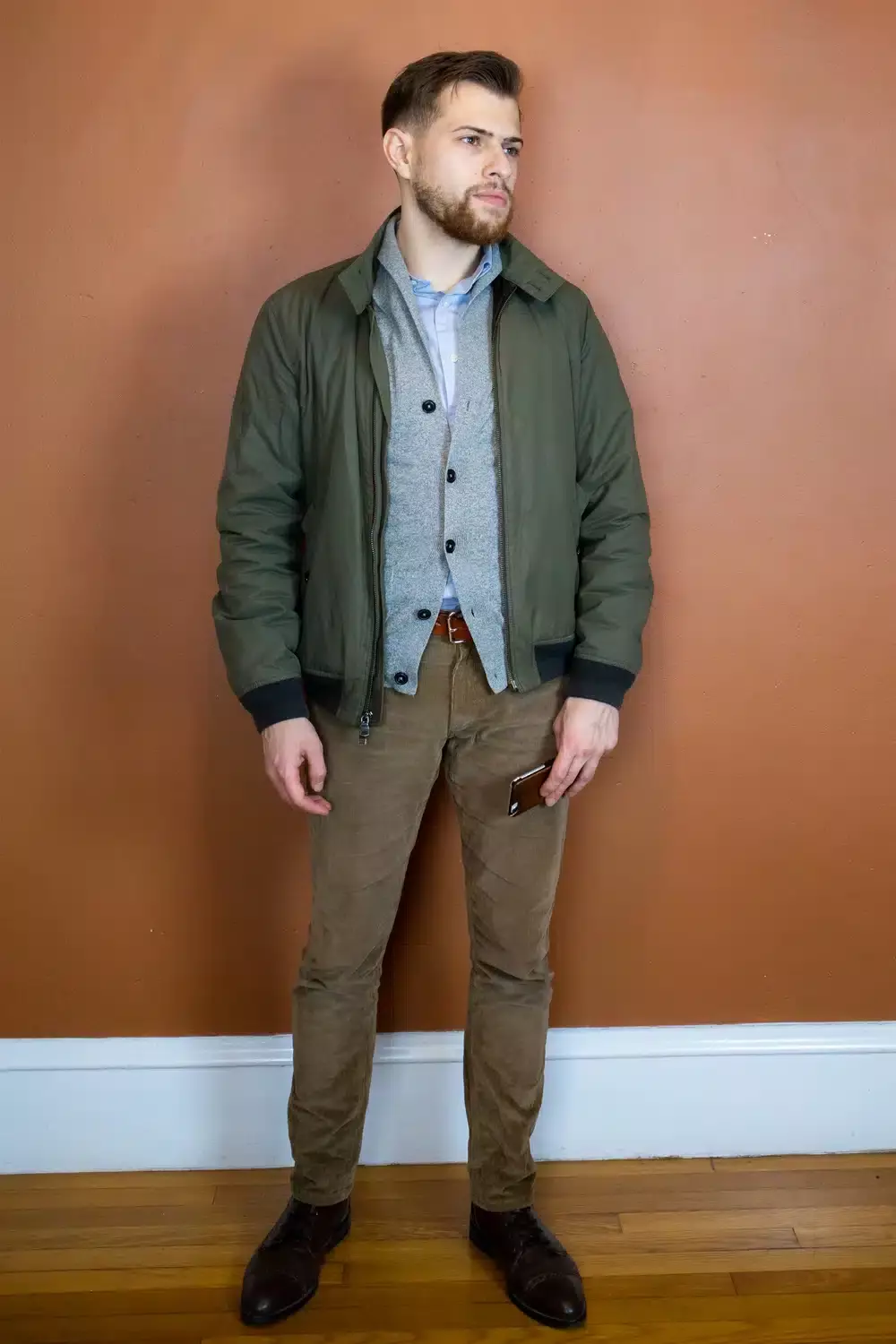 Ryan Wearing Bomber jacket over cardigan