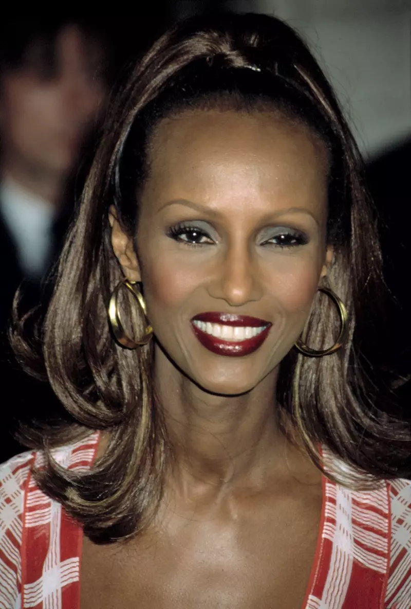 Supermodel Iman shines with gold hoop earrings.