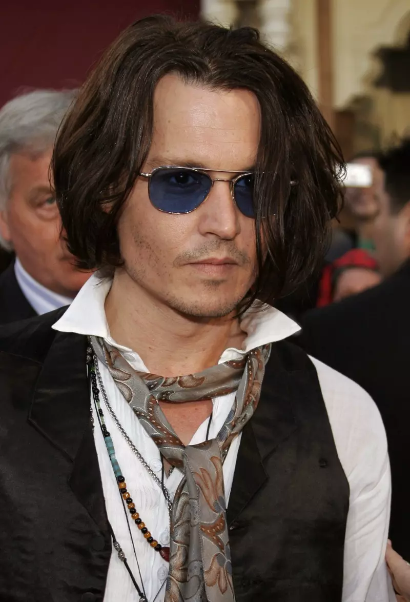 Johnny Depp rocks sunglasses with blue lenses for the 2007 world premiere of Pirates of the Caribbean: At World’s End at Disneyland in Anaheim, California.