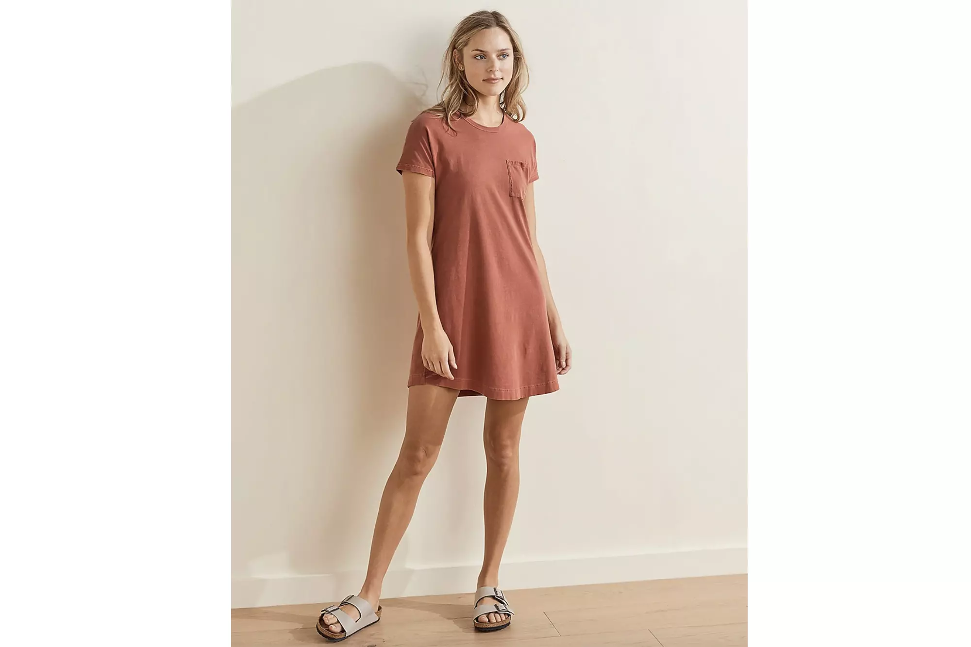 A woman in a red t-shirt dress